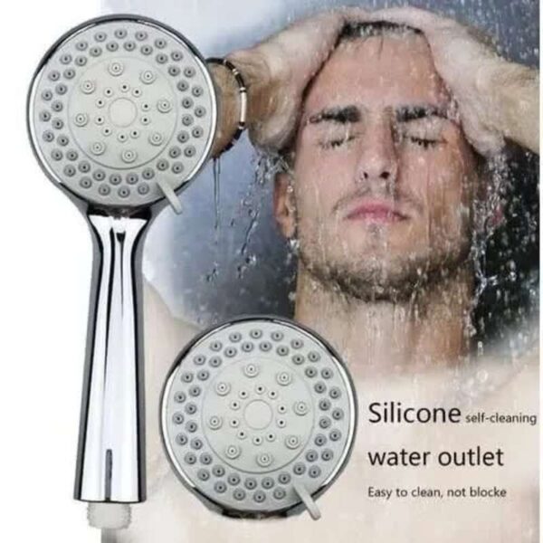 Image of a man with short dark hair showering, holding his head with both hands under running water. The man has light skin and a slight beard. Two shower heads with multiple nozzles are shown in the foreground, one in profile and one facing forward. Text on the image reads: "Silicone self-cleaning water outlet. Easy to clean, not blocke.